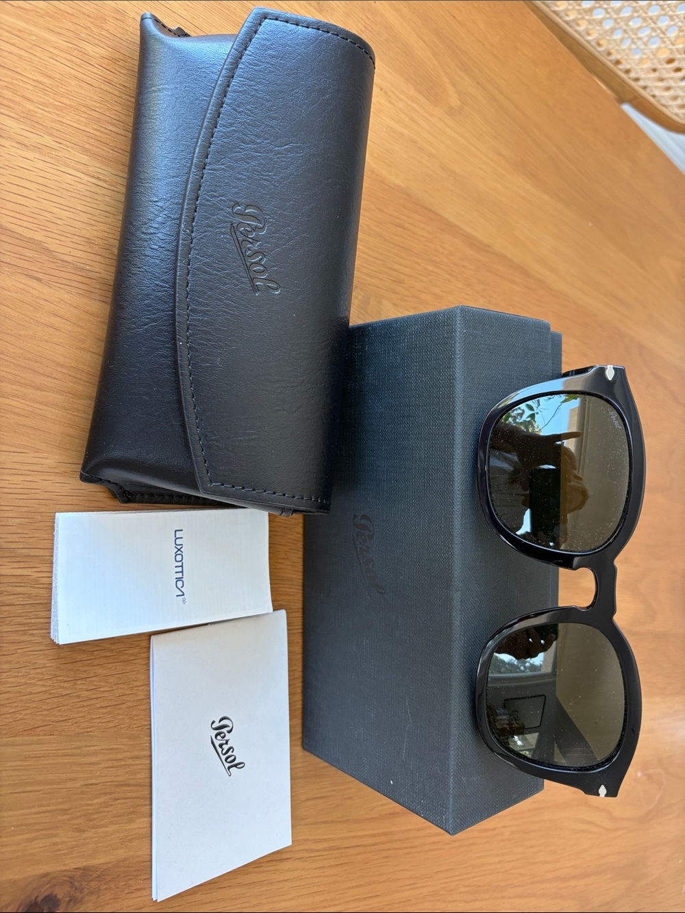 Persol Black Round Sunglasses with Dark Lenses and Silver Accents